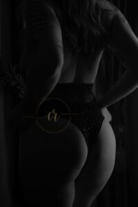 A photo of Mary's back in black and white from her boudoir photoshoot in East Texas